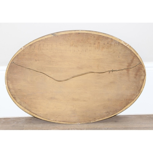 459B - An antique gilt framed oval shaped wall mirror, approx 83cm x 57cm