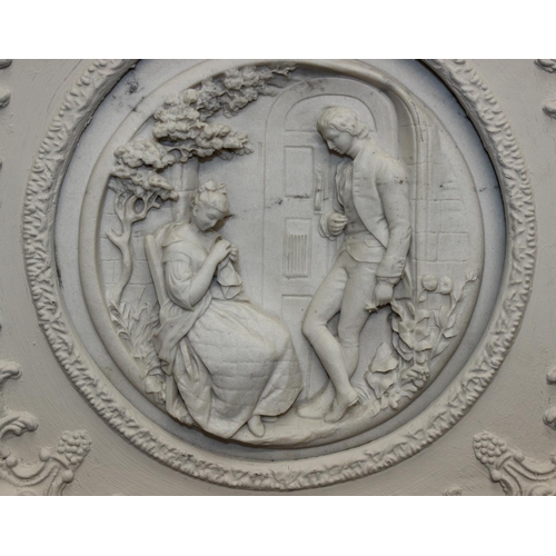 459G - An antique style reconstituted marble plaque in distressed white painted frame, the relief plaque de... 