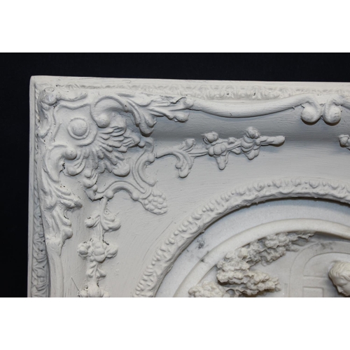 459G - An antique style reconstituted marble plaque in distressed white painted frame, the relief plaque de... 