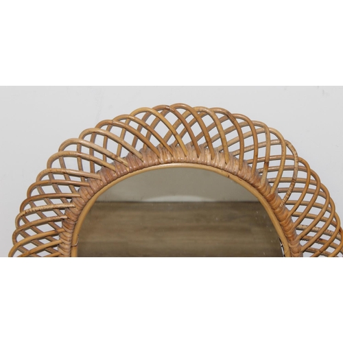 495A - A retro bamboo framed wall mirror, oval shaped, approx 73cm x 60cm