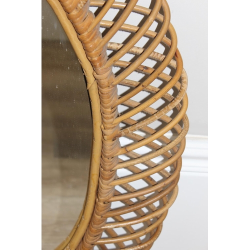 495A - A retro bamboo framed wall mirror, oval shaped, approx 73cm x 60cm