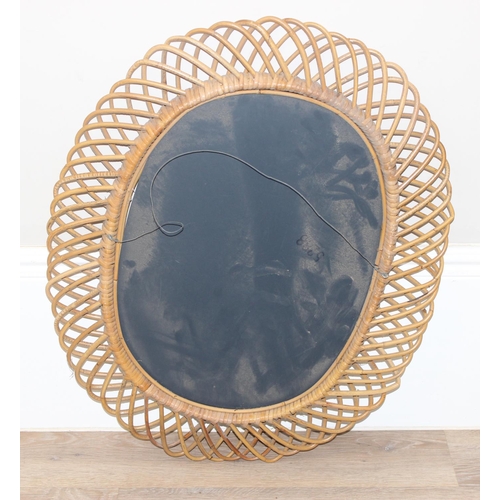 495A - A retro bamboo framed wall mirror, oval shaped, approx 73cm x 60cm