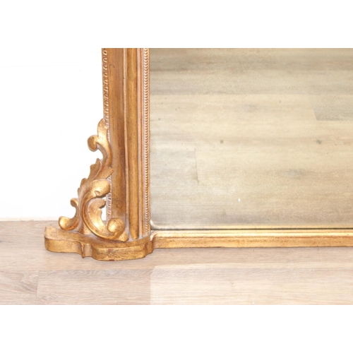 543 - An antique style gilt framed over mantel mirror, approx 143cm x 100cm