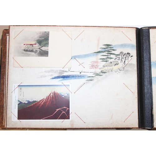 598 - An early 20th century Japanese black lacquer and Shibayama inlaid photograph album containing photog... 