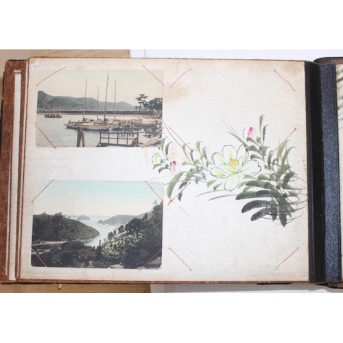 598 - An early 20th century Japanese black lacquer and Shibayama inlaid photograph album containing photog... 