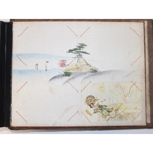 598 - An early 20th century Japanese black lacquer and Shibayama inlaid photograph album containing photog... 