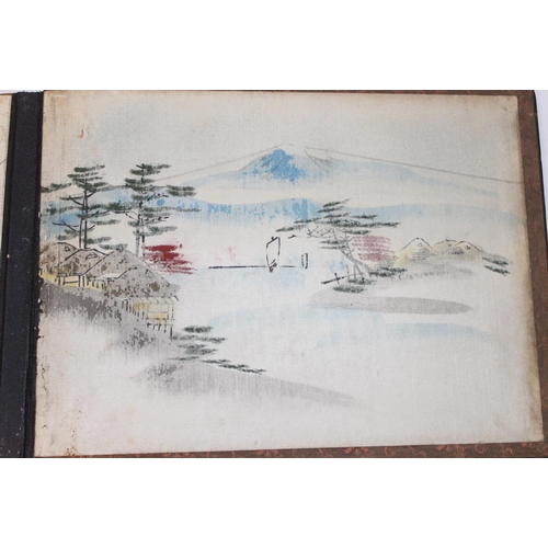 598 - An early 20th century Japanese black lacquer and Shibayama inlaid photograph album containing photog... 