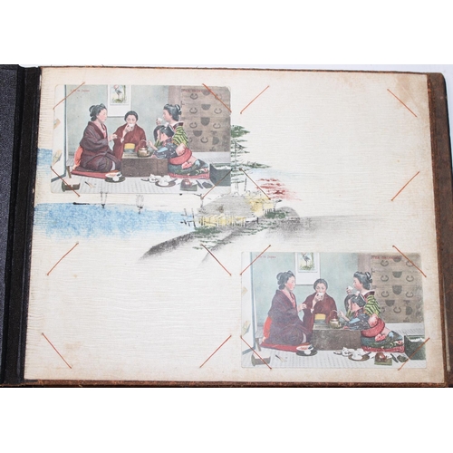 598 - An early 20th century Japanese black lacquer and Shibayama inlaid photograph album containing photog... 