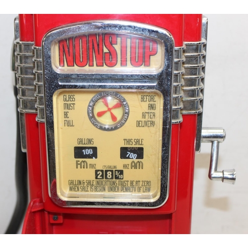 697 - 2 novelty radios, one formed as a Pepsi can, the other a vintage fuel pump, the largest approx 58cm ... 