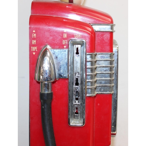 697 - 2 novelty radios, one formed as a Pepsi can, the other a vintage fuel pump, the largest approx 58cm ... 