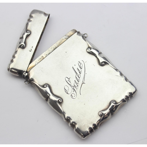 1004 - An Edwardian silver visiting card case with engraved name 