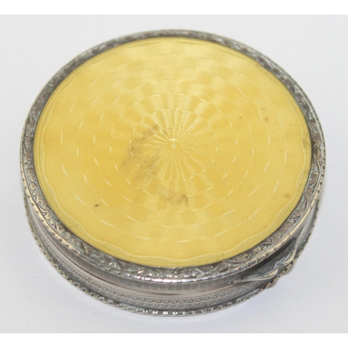 1016 - A vintage silver and yellow guilloche enamel pill box, the interior lined with gilt, marked 0.935 an... 