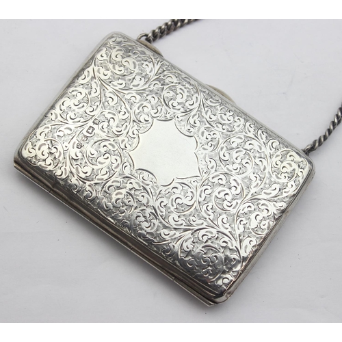 1039 - An Edwardian silver purse or card holder with acanthus scroll engraving and chain holder, marked for... 