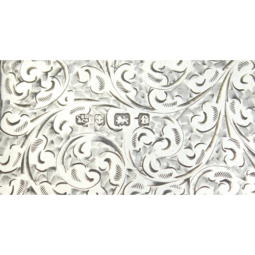 1039 - An Edwardian silver purse or card holder with acanthus scroll engraving and chain holder, marked for... 