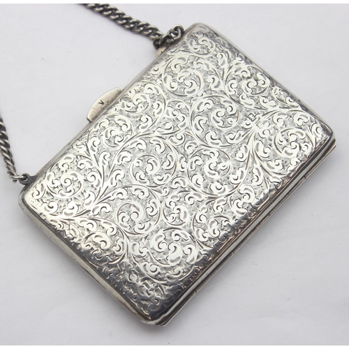 1039 - An Edwardian silver purse or card holder with acanthus scroll engraving and chain holder, marked for... 