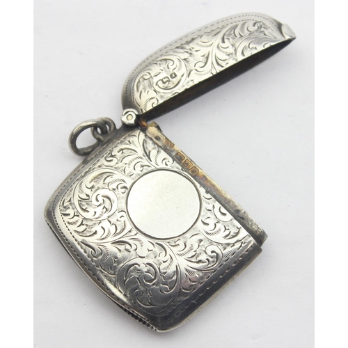 1041 - An antique silver vesta case with acanthus engraved scrolls, rounded form, marked for Chester 1909 b... 