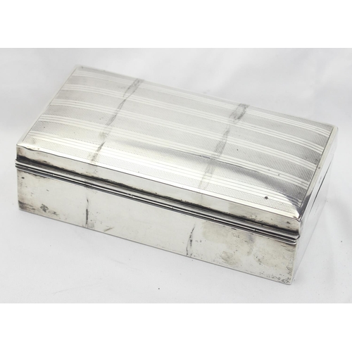 1042 - A silver mounted cigarette case with wooden lining, engine turned decoration to top, marked for Lond... 