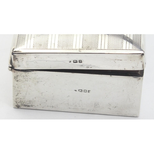 1042 - A silver mounted cigarette case with wooden lining, engine turned decoration to top, marked for Lond... 