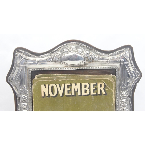 1053 - A silver mounted desktop calendar with paper labels, missing dates 11 & 12, frame marked for Birming... 