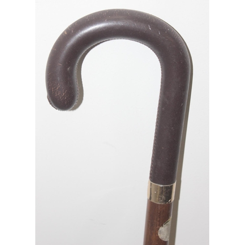 1060 - An early 20th century silver mounted riding crop by Brigg, marked for London 1924, an umbrella and 2... 