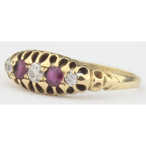 1102 - An antique diamond and ruby set ring, a central diamond assessed as approx 0.25ct flanked by 2 rubie... 