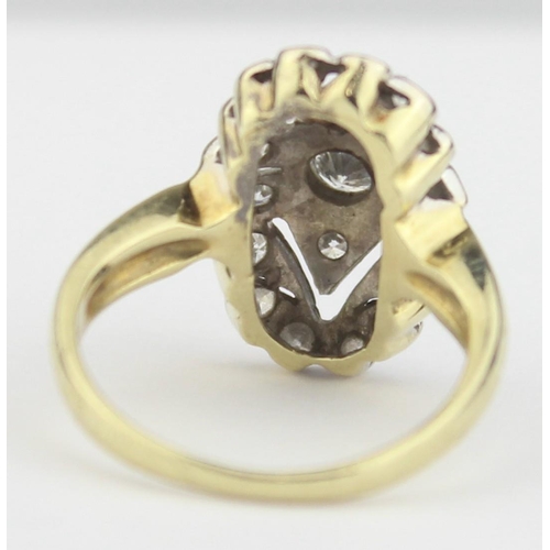 1104 - An Art Deco period 14ct gold and diamond set cluster ring, the central diamond assessed as approx 0.... 