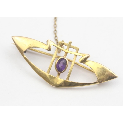 1119 - An Art Nouveau period 9ct gold and amethyst set brooch, marked 9ct and XRF confirmed, approx 40mm wi... 