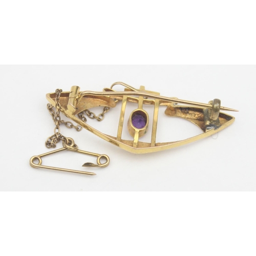 1119 - An Art Nouveau period 9ct gold and amethyst set brooch, marked 9ct and XRF confirmed, approx 40mm wi... 