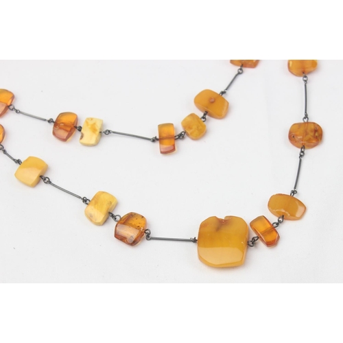 1126 - A silver and amber necklace and 2 silver mounted hardstone bead bracelets, one with a matching pair ... 