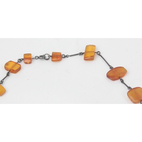 1126 - A silver and amber necklace and 2 silver mounted hardstone bead bracelets, one with a matching pair ... 