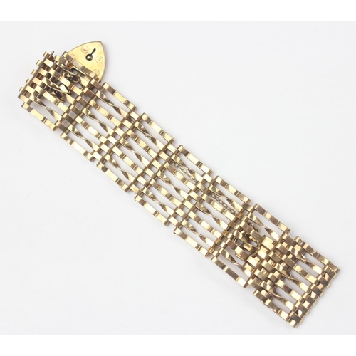 1127 - A vintage 9ct gold 7 bar gate bracelet with heart shaped padlock clasp, marked and XRF confirmed, ap... 