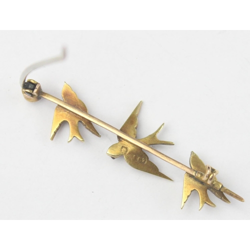 1130 - An antique 15ct gold bar brooch formed as a trio of swifts or swallows set with seed pearls, indisti... 