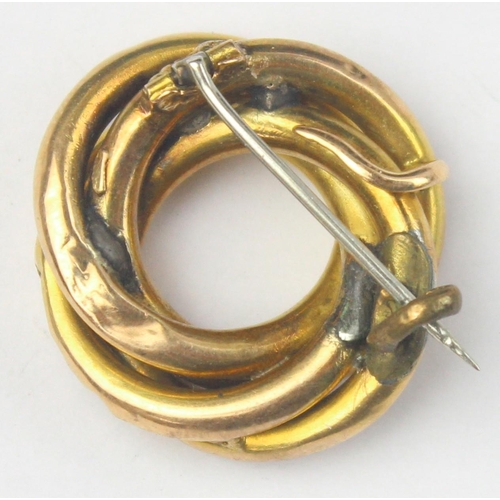 1131 - An antique yellow metal knot brooch, seemingly unmarked but XRF assessed as 15ct gold, approx 28mm w... 