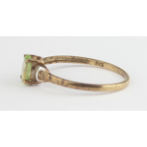 1134 - A 9ct gold and peridot ring, marked 9ct and XRF confirmed, approx size N, approx 0.91g gross