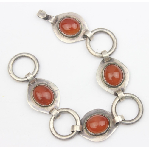 1140 - A retro mid-century handmade Scandinavian style silver bracelet formed with 4 amber coloured cabocho... 