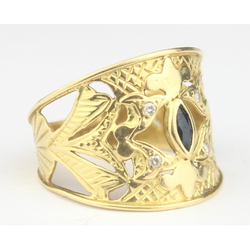 1144 - An unusual thick 18ct gold pierced band ring set with a marquise shaped sapphire flanked by 4 small ... 