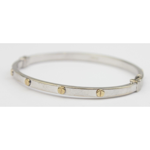 1147 - A vintage 9ct white gold with yellow gold flat screwhead design in the manner of Cartier, Italian ha... 