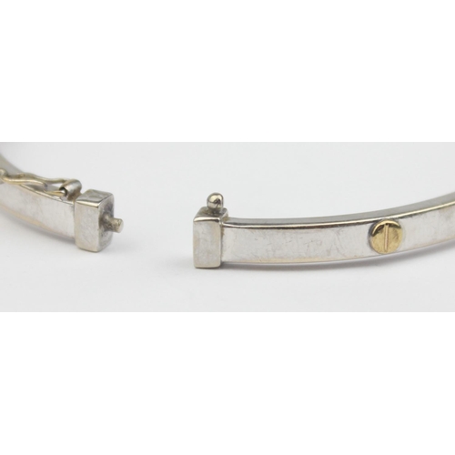 1147 - A vintage 9ct white gold with yellow gold flat screwhead design in the manner of Cartier, Italian ha... 