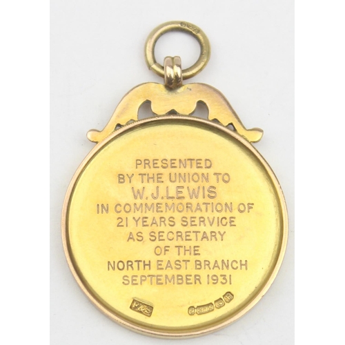 1153 - An early 20th century 9ct gold fob medal awarded by The Working Men's Club & Institute Ltd to a bran... 