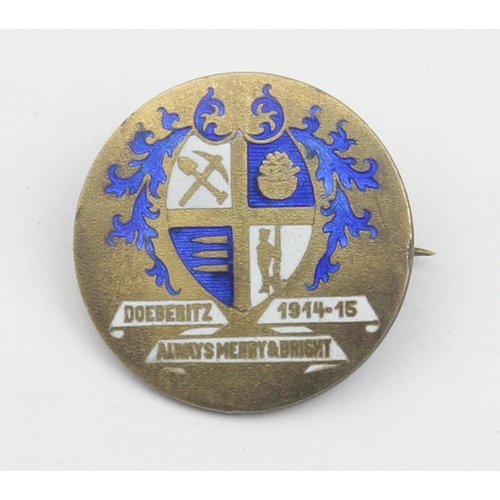 1403 - A rare WWI period silver gilt and enamel badge relating to the First World War prisoner of war camp ... 