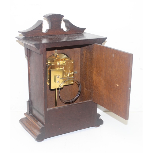 1325 - A vintage Lenzkirch of Germany oak cased mantel or bracket clock with key and pendulum, approx 40cm ... 