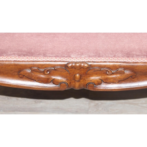 35 - A large vintage footstool with burgundy upholstered top and carved mahogany frame, approx 98cm wide ... 