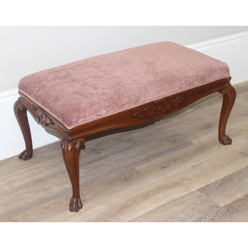 35 - A large vintage footstool with burgundy upholstered top and carved mahogany frame, approx 98cm wide ... 