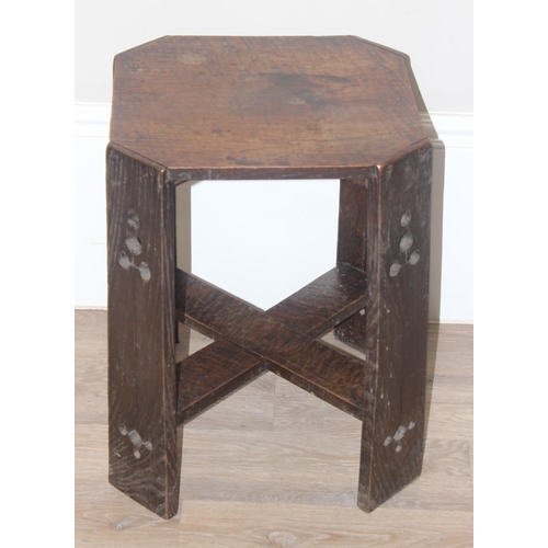 36 - An Arts & Crafts period oak side table in the manner of Liberty & Co, the legs with pierced design, ... 