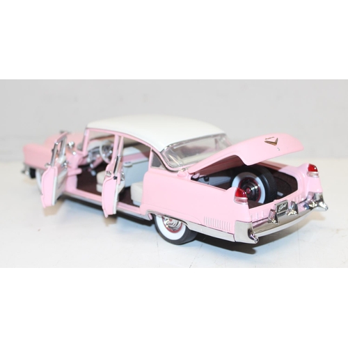 712 - Franklin Mint - a 1:24 scale model of Elvis Presley's 1955 pink Cadillac Fleetwood, with paperwork