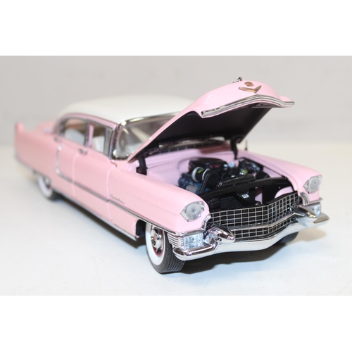 712 - Franklin Mint - a 1:24 scale model of Elvis Presley's 1955 pink Cadillac Fleetwood, with paperwork