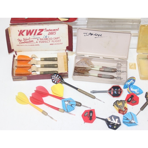 801 - Qty of vintage darts and accessories of varying size and weights to include flights and cases