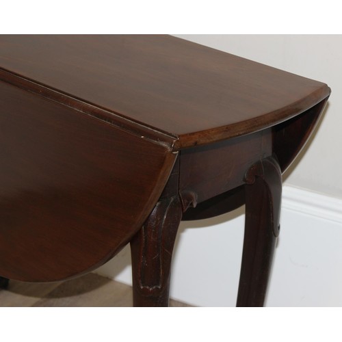 133 - An antique mahogany drop leaf table with carved legs and pad feet, approx 99cm wide x 36cm deep x 72... 