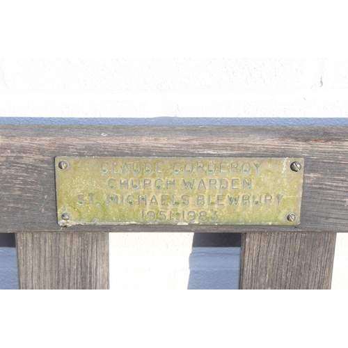 357 - A wooden garden bench, approx 158cm wide, with plaque