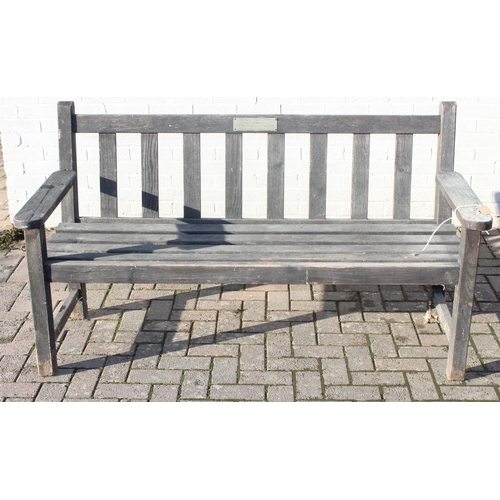 357 - A wooden garden bench, approx 158cm wide, with plaque